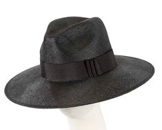 This beautiful black ladies hat features classic fedora shape with fashionable wide brim. It is made from real natural sisal.  Real sizal  Wide brim  Classic elegant shape Elegant Wide Brim Toquilla Straw Fedora, Elegant Fedora Panama Hat In Toquilla Straw, Elegant Boater Hat With Curved Brim In Toquilla Straw, Elegant Fedora Panama Hat For Vacation, Luxury Wide Brim Panama Hat For Spring, Elegant Sun Hat With Curved Brim In Toquilla Straw, Chic Formal Panama Hat With Flat Brim, Elegant Toquilla Straw Sun Hat With Curved Brim, Luxury Curved Brim Fedora For Spring