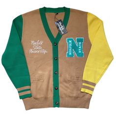 Make a bold statement and wear your Norfolk State pride with this one-of-a-kind and comfortable cardigan sweater, perfect for any alumni, students or supporters. Made with the highest quality materials, this sweater is designed to keep you warm and cozy while representing NSU. Features:- Official Norfolk State University logo embroidered on the chest- Large "N" Chenille patch- Classic cardigan design with a tortoise shell button-up front- Two front pockets (deep enough to fit a phone and other e Sporty Fall Cardigan For College, Varsity Cardigan For Winter College Season, Winter Varsity Cardigan, Varsity Style Cardigan For College In Winter, Varsity Style Winter Cardigan For College, Fall College Cardigan With Ribbed Cuffs, Winter College Style Sweater For Campus, Sporty Fall Sweater For School, Casual Winter Cardigan For College