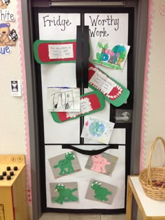 a refrigerator decorated with magnets and paper cutouts for kids to write on it