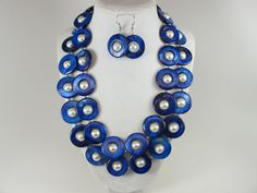 Statement mother of pearl  blue and white necklace,  blue and white shell Pearl Necklace Necklace, blue necklace, white  statement shell   Necklace is made from blue mother of pearl donut beads and white glass beads 10mm,  measures approx. 19" plus an additional 4" inches with silver extender. 2 Strands, light weight. Closure is a  lobster clasp with silver extender chain with bead dangle. My beautiful jewelry makes warm and personal gift for you, your family and friends, and all come in jewelry Handmade Blue Shell Jewelry, Blue Shell-shaped Handmade Jewelry, Blue Beaded Shell-shaped Necklace, Blue Beaded Shell Necklace, Handmade Blue Shell Beaded Necklaces, Elegant Handmade Blue Shell Necklace, Handmade Blue Shell, Blue Shell-shaped Necklaces, Blue Shell Beaded Necklaces With Round Beads