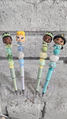 four different disney princess and the frog pens