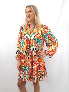 colorful babydoll shirt dress on model from front Multicolor Lantern Sleeve Dress For Spring, Multicolor Lantern Sleeve Spring Dress, Multicolor Smock Dress For Fall, Multicolor Floral Print Dress With Balloon Sleeves, Multicolor Abstract Print Long Sleeve Dress, Long Sleeve Multicolor Abstract Print Dress, Colorful Long Sleeve Dress For Fall, Colorful Long Sleeve Dresses For Fall, Summer Multicolor Dresses With Balloon Sleeves