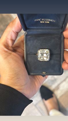 someone is holding an old diamond ring in their hand and it looks like they have been purchased