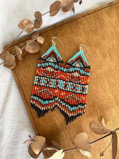 These tribal-style beaded earrings are made from selected Czech beads. Native seed bead earrings can be an excellent personalized gift for bridesmaids, Mothers Day, Birthdays, Valentine's Day, Wedding day, Christmas, New Year, and for your loved ones. ♡ Length - 4.5'' (11.5 Centimeters) ♡ Width - 1.2'' (3.5 Centimeters) ♡ Quality Czech beads ♡ Stainless steel hooks/925 Silver hooks I accept payments through Paypal. More tribal earrings are available in my Etsy shop: https://www.etsy.com/listing/ Traditional Beaded Fringe Dangle Earrings, Southwestern Style Beaded Earrings, Traditional Beaded Fringe Drop Earrings, Southwestern Beaded Fringe Earrings For Gift, Southwestern Dangle Beaded Earrings As Gift, Artisan Beaded Fringe Earrings As Gift, Artisan Beaded Earrings With Round Beads For Festivals, Southwestern Dangle Beaded Earrings For Gifts, Artisan Beaded Fringe Earrings For Gifts