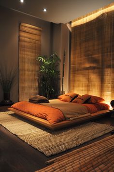 a large bed sitting in the middle of a bedroom next to a window with bamboo blinds