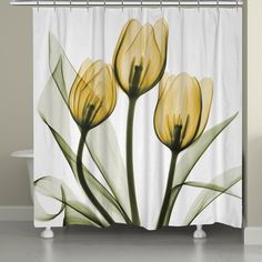 three yellow tulips on a white background shower curtain