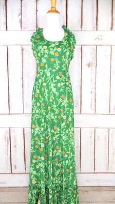 "70s vintage green floral maxi halter dress/long boho hippie ruffle festival dress/xsmall/small Measurements...taken flat -estimated fit: xsmall/small -marked size: vintage juniors 13 -across bust: 15\" -across waist: 13\" -length: 59\" Features... -awesome floral print throughout -beautiful ruffle detail hemline -pretty ruffle detail on halter top -back zipper -unlined -polyester/triacetate -Rage of California Condition... -excellent vintage condition -minimal wear DC1303*" Spring Festival Ruffled Maxi Dress, Ruffled Spring Festival Maxi Dress, Fitted Green Maxi Dress For Summer, Green Floral Print Hippie Maxi Dress, Green Spring Sundress Maxi Dress, Green Sundress Maxi Dress For Spring, Green Fitted Halter Neck Maxi Dress, Fitted Green Halter Neck Maxi Dress, Green Floral Print Hippie Dress