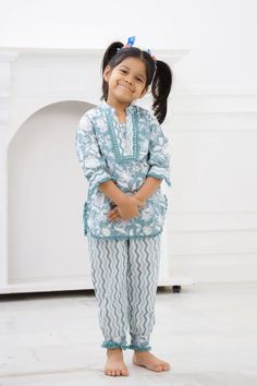 Our Girls Kurta Salwar is a must-have for your Girls. Made with 100% pure cotton cambric, this kurta is quite soft and tactile to touch making it a perfect match for your small one. Traditional print in pretty colours makes this kurta look distinctively good while wearing it. Composition: 100% cotton cambric This Kurti salwar is a perfect combination of style and comfort. The kurti is made of pure cotton cambric and has a kurti with Afghani Pants that has velzera tassel cotton lace on kurti slee White Cotton Sharara For Diwali, Green Cotton Sharara For Navratri, Cotton Pant Set With Chikankari Embroidery For Eid, White Cotton Sharara For Eid, Eid Cotton Pant Set With Chikankari Embroidery, Festive Green Cotton Pant Set, White Cotton Sharara For Festive Occasions, Traditional Cotton Pant Set With Printed Motifs, Festive Cotton Pant Set For Eid