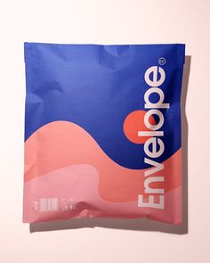 a close up of a bag of food on a white surface with a pink and blue background