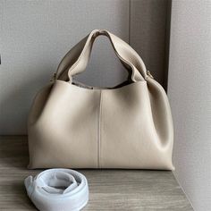 SPECIFICATIONSStyle: FashionShape: BucketPlace Of Origin: GUANG DONG ProvincePlace Of Origin: GUANG DONG ProvincePattern Type: SolidOrigin: CN(Origin)Occasion: VersatileMain Material: Split LeatherLining Material: CottonInterior: Interior Zipper PocketHardness: SoftGender: WOMENDecoration: RibbonsClosure Type: HaspCN: GuangdongBrand Name: MKCCCKAsize: length 32CM* width16CM * height19CMThere may be 1-2cm error in size. We try our best to keep the physical objects consistent with the pictures, bu Minimalist Bags, Types Of Purses, My Style Bags, Dumpling Bag, Minimalist Bag, Lunch Box Bag, Box Bag, Work Travel, Pure Color