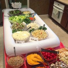 an inflatable buffet table filled with lots of food