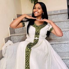 This gorgeous green Habesha dress features a modern design that beautifully blends tradition with contemporary fashion. Perfect for any occasion, this Ethiopian traditional dress offers elegance and cultural richness. Material Cotton Menen Thread Estimated delivery : 1 week to 2 weeks Contact WhatsApp +1(304)-306-2784Email: contact@ethiopian.store Habesha Kemis Modern, Habesha Dress Modern, Habesha Dress, Ethiopian Traditional Dress, Habesha Kemis, Dress Modern, Modern Dress, Traditional Dress, Green Design