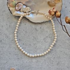 "Cultured Freshwater Pearl Strand Necklace.  Princess of 18\" or Matinee Length of 24\" long. Pearl Size: 8-9MM. Pearl Quality: Lightly wrinkled and blemished.  Great luster. Pearl Shape: semi-round. Finding: Sterling silver toggle loop clasp. https://www.etsy.com/shop/MYGEMSROCK" Classic 16 Inch Necklace For Gift, Classic Single Strand Necklace Gift, Classic Adjustable 16 Inch Necklace, Classic Necklace With Lobster Clasp For Anniversary, Classic Wedding Necklace With Lobster Clasp, Beaded Necklace With Sterling Silver Clasp As Gift, Classic Adjustable Beaded Necklace As Gift, White Sterling Silver Clasp Necklace For Everyday, White Necklace With Sterling Silver Clasp For Everyday