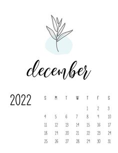 a calendar with the word december written in black and white, next to a leaf