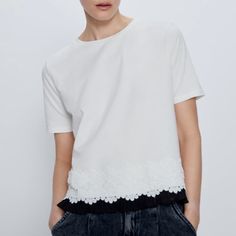 New Zara Contrasting Fabric T-Shirt Round Neck T-Shirt With Short Sleeves, Matching Embroidery Detail And Contrast Pleated Cotton Grown Using Natural Fertilisers And Pesticides. Moreover, No Genetically Modified Seeds Are Used During Its Cultivation, Thus Helping To Preserve Seed Biodiversity And Soil Fertility. White Cotton Short Sleeve Top For Spring, Chic Zara T-shirt With Crew Neck, Chic White Cotton T-shirt, White Cotton Crew Neck Blouse, Chic Zara T-shirt For Spring, Chic White Crew Neck Top, Chic White Short Sleeve Tops, Chic Zara Crew Neck T-shirt, Chic Zara Short Sleeve Tops