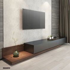 a tv is mounted on the wall in a room with wood flooring and white walls