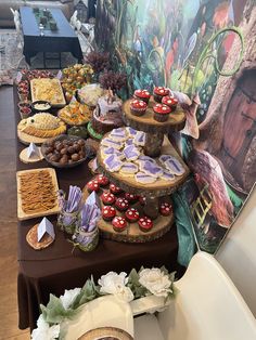 an assortment of desserts displayed on a table