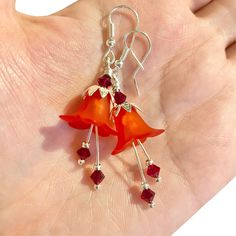 Garnet Red Floral Earrings, lightweight red acrylic flowers are paired with ruby Swarovski crystals that have beautiful sparkle when they move. The pretty detailed silver bead caps add that perfect touch of detail, the ornate silver floral bead caps compliment the flowers and silver ear wires finish them off beautifully. A perfect summer accessory or gift. These gorgeous red flower earring drops hang approximately 35mm from handmade silver plated ear wires. ▪️ One of a kind, only one made. ▪️ Th Red Flower Earrings With Ear Wire For Party, Handmade Red Flower Earrings For Party, Red Flower Drop Earrings, Red Flower Earrings With Ear Wire, Red Dangle Flower Earrings, Red Flower-shaped Earrings With Ear Wire, Red Flower Shaped Earrings With Ear Wire, Adjustable Red Flower Earrings With Ear Wire, Red Flower Earrings