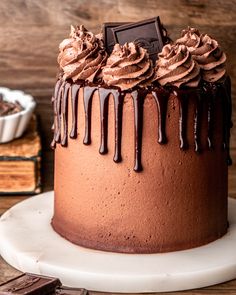 a cake with chocolate frosting and drizzled on top