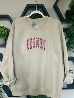 This Dog Mom Crewneck is the perfect sweatshirt to wear on your next trip to the park or to snuggle with your pups! This design features a pink floral fabric that is embroidered on a Gildan Heavy Blend Sand Crewneck. This crewneck runs slightly oversized. I recommend sizing up for an oversized fit. Pink Sweatshirt With Embroidered Logo For Spring, Casual Pink Sweatshirt With Floral Embroidery, Pink Cotton Sweatshirt With Floral Embroidery, Spring Pink Sweatshirt With Embroidered Graphics, Pink Embroidered Sweatshirt For Spring, Pink Sweatshirt With Custom Embroidery In Relaxed Fit, Relaxed Fit Pink Sweatshirt With Embroidered Graphics, Pink Embroidered Sweatshirt With Relaxed Fit, Pink Embroidered Relaxed Fit Sweatshirt