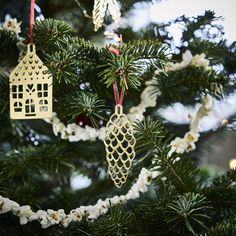 ornaments hanging from the branches of a christmas tree