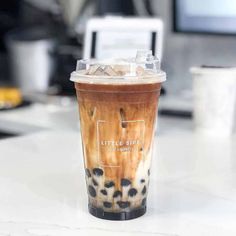 a coffee cup sitting on top of a table