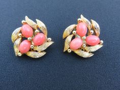 Gorgeous, hard to find orange coral cabs clip on vintage earrings by Italian designer Benedetto Panetta.   Cabochons are surrounded by delicate petals on textured gold tone metal and hallmarked on the reverse. Highly collectible, Panetta jewelry is no longer made and well known for it's high quality costume jewelry. Excellent condition, measures 7/8 inch across, clips in good working order. Elegant Orange Clip-on Earrings, Orange Clip-on Earrings For Formal Occasions, Formal Orange Clip-on Earrings, Vintage Orange Clip-on Earrings, Vintage Boho Fashion, Estilo Boho Chic, Daily Gift, Orange Coral, Italian Designer