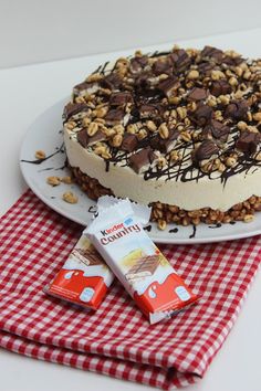 a cake on a plate with chocolate and nuts