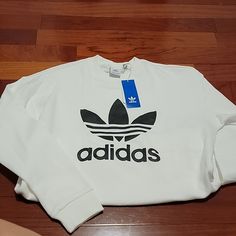 New With Tag, Size S White Logo Crew Neck Sweatshirt, Long Sleeve Logo Tops In Athleisure Style, Athleisure Long Sleeve Tops With Logo, White Logo Print Sweatshirt For Sports, White Long Sleeve Sweatshirt With Three Stripes, White Sports Sweatshirt With Logo Print, White Adidas Logo Sweatshirt For Sports, White Adidas Logo Sporty Sweatshirt, White Long Sleeve Adidas Sweatshirt