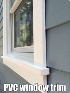 a close up of a window on the side of a house with siding and windows