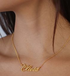 Script Font Name Plate Necklace With Rolo Chain.Designed in ItalyAvailable in 14K/18K Options Thickness: 0.8MMDimensions: 1.5" x 0.75" Custom Fonts Available Upon Request.Iced Out upon requestContact: sales@saintsgold.com Made to order. Allow 8-10 business days for production. Luxury Sterling Silver Name Necklace For Formal Occasions, Luxury Sterling Silver Name Necklace For Formal Events, Gold Nameplate Necklace In Fine Jewelry Style, Fine Gold Nameplate Necklace, Formal Name Pendant Necklace, Classic Yellow Gold Pendant Name Necklace, Gold Custom Necklace With 17 Jewels For Formal Occasions, Formal Pendant Name Necklace, Luxury 14k Gold Jewelry For Celebration