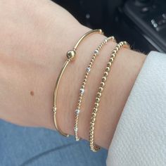 A chic trio of 14k Gold filled stretch bracelets. these gold beaded bracelets are made using a combination of 2mm and 3mm gold filled beads.  Gold filled is a much more economical material compared to solid gold but wears much better than gold plated, if cared for will last as well as solid gold.  The set comes with our dainty mixed metal bracelet, perfect for adding some sparkle, a gold bangle style bracelet and a simple 3mm beaded bracelet. Each bracelet can also be purchased individually.  SI Mixed Metal Stacked Bracelets, Mixed Metal Bracelet, Gold Beaded Bracelets, Mixed Metal Bracelets, Turquoise Choker, Eco Jewelry, Gold Bracelet Set, Stacking Bracelets, Hippie Bracelets