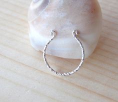 This listing is for ONE unique fake septum ring cuff 925 sterling silver .~NO PIERCING REQUIRED~It is extremely comfortable to wear and look just like a real piercing, without the pain!adjustable to fit your nose comfortably.HOW TO WEAR IT: Open the cuff slightly if necessary. Slide the cuff up around your nasal septum and squeeze gently to secure in place. THAT'S IT!size:22 gauge.Inner Diameter :8mmOther fake septum cuffs:https://www.etsy.com/listing/212526033/tribal-gold-fake-septum-ring-faux- Nickel-free Sterling Silver Septum Ring, Silver Open Ring Septum As Gift, Silver Open Ring Septum Gift, Hypoallergenic White Gold Septum Ring In Sterling Silver, Handmade Sterling Silver Septum Ring, Hypoallergenic Sterling Silver Septum Ring, Nickel-free White Gold Sterling Silver Nose Rings, White Gold Sterling Silver Septum Ring Gift, Adjustable Sterling Silver Hoop Septum Ring