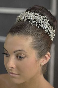 a woman wearing a bridal head piece