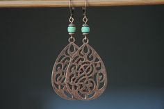 Copper Green Boho Earrings Dangle Drop earrings LONG LARGE Boho Jewelry Bohemian Earrings Bohemian Jewelry Gift For women Large boho earrings made with copper filigree floral teardrop blanks and green brown Czech glass rondelle beads. They dangle from antique copper lever backs ( lead and nickel free ). The rich warm brown antique copper findings give to these earrings a lovely rustic boho look and will compliment any outfit. Very large and long statement pieces of jewelry. Color : Green Czech Glass rondelle beads  Finish : Antique copper floral filigree teardrop ( Lead and nickel safe). Length: 2 3/4 inches including the antiqued copper  lever backs Copper Earrings : https://www.etsy.com/shop/NtikArtJewelry?ref=l2-shopheader-name&section_id=16059935 To visit my shop : https://www.etsy.com Bohemian Copper Wire Wrapped Teardrop Earrings, Bohemian Wire Wrapped Teardrop Earrings, Bohemian Bronze Teardrop Dangle Earrings, Bohemian Green Pierced Teardrop Earrings, Bronze Bohemian Teardrop Dangle Earrings, Bohemian Green Teardrop Pierced Earrings, Bohemian Copper Teardrop Earrings, Bohemian Brown Teardrop Nickel-free Earrings, Bohemian Brown Nickel-free Teardrop Earrings