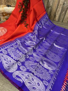 Gorgeous red pure silk handloom saree with large zari butas and grand  contrast border. -Pure Kanjivaram silk saree authenticated by Silk Mark Certificate. -Blouse fabric included. -Fall attached. Note:  - Slight inconsistency in weaving is inherent to handloom sarees and is not a defect. -The color of the products may slightly vary according to the ambient lighting conditions and the color calibration of LED devices. If you would like more clarity before your purchase, please drop us a message . Red Banarasi Silk Saree For Transitional Season, Red Paithani Silk Saree For Diwali, Transitional Red Saree With Zari Weaving, Red Paithani Silk Handloom Saree, Red Katan Silk Saree For Festivals, Transitional Red Katan Silk Saree, Red Silk Traditional Wear With Border, Red Handloom Saree For Diwali, Transitional Red Tussar Silk Saree