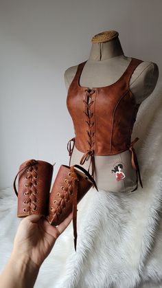 Unique quality real calf leather is used.  With its historical texture, it is a vest bodice that you will enjoy using at costume parties, renaissance fairs, concerts or in your daily life. Ajdustable size with 3 elevator with eyelets.  Ready to shipping  Worldwide free express shipping is used Any size avaliable . Please message me your bust, waist and height measurements ++  Customs and import taxes that may occur in customers country are the customer's responsibility. Medieval Vest Women, Womens Plus Size Viking Costume, Leather Viking Costume, Leather Vest For Women, Luxury Medieval Cosplay Costume For Larp, Womens Vikings Costume, Fitted Leather Corset For Cosplay, Vintage Brown Corset For Larp, Brown Corset For Cosplay