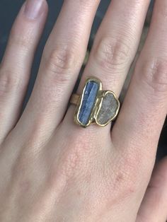 With the fierceness of a tidal wave, ocean blue kyanite and labradorite are embedded in brass to create this statement ring. Length 3/4 in Width 3/4 in This piece is handmade-to-order, please allow 1 - 2 weeks to ship unless this piece is in stock. Each piece will vary slightly due to the uniqueness of the stones. All metal is nickel free. Blue Labradorite Jewelry With Large Stone, Adjustable Blue Brass Ring, Unique Blue Raw Stone Jewelry, Unique Blue Jewelry With Raw Stone, Blue Labradorite Ring, Blue Brass Ring Jewelry, Hand Forged Labradorite Blue Jewelry, Blue Hand Forged Jewelry For Healing, Hand Forged Blue Labradorite Jewelry