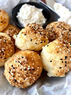 rolls with sesame seeds and cottage cheese in a basket