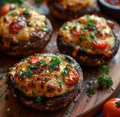 baked stuffed mushrooms with tomatoes and cheese on a cutting board