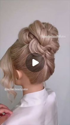 a woman with blonde hair in a bun