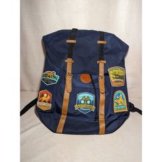 a blue backpack with patches on it