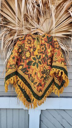 Vintage circa 70s woven gold and green fringed poncho. Tie front closure. Has a bit of vintage wooly smell. Beautiful design. Shop our bandanas here: https://www.etsy.com/shop/VintageAvengerBoheme?ref=seller-platform-mcnav§ion_id=28596485 Shop more of our items here: https://www.etsy.com/shop/VintageAvengerBoheme?ref=ss_profile Width: 64"  Length front: 32" * Please measure for best fit * All sales final * Thank you  Shop our regular website at  https://www.vintageavengerhumboldt.com/ Green Bohemian Poncho For Fall, Traditional Fringe Poncho For Fall, Yellow Bohemian Poncho For Fall, Hippie Brown Poncho For Festivals, One Size Vintage Poncho For Winter, Green Bohemian Poncho For Festivals, Traditional Fall Poncho With Fringe, 70s Shawl, Bohemian Yellow Poncho One Size