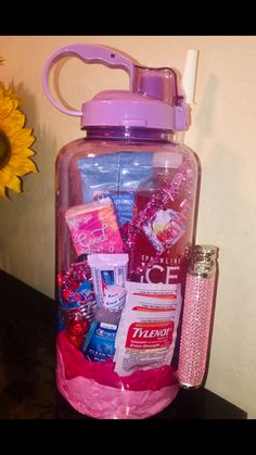 a pink plastic container filled with lots of items