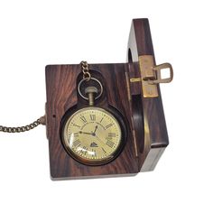 a wooden clock with chain attached to it's side and key on the front