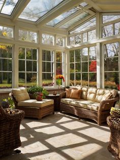 a sun room with wicker furniture and large glass windows on the ceiling is shown