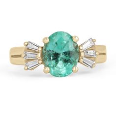 A unique glorious emerald and diamond ring. The center stone carries almost two carats of a stunning, oval-cut Colombian emerald. The gemstone displays a bright spring green color and very good eye clarity. Set in a four-prong setting, accented by three petite baguette-cut diamonds on either side. Carefully set and crafted in a 14K yellow gold setting. Setting Style: Prong Setting Material: 14K Yellow Gold Setting Weight: 4.4 Grams Main Stone: Emerald Shape: Oval Cut Weight: 1.98-Carats Clarity: Timeless Oval Ring With Baguette Diamonds, Timeless Oval Rings With Baguette Diamonds, Oval 14k Gold Rings With Baguette Diamonds, Oval Baguette Diamond Rings In Timeless Style, Oval Rings With Baguette Diamonds In 14k Gold, Oval Green Baguette Diamond Jewelry, Oval Green Jewelry With Baguette Diamonds, Green Oval Baguette Diamond Jewelry, Green Oval Jewelry With Baguette Diamonds