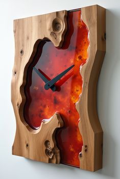 a clock made out of wood with red and orange paint on the face is shown