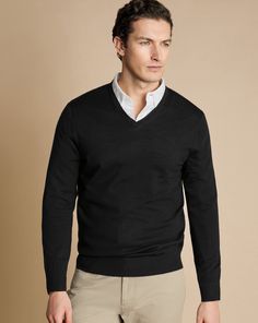 100% merino wool, V-neck, Contrast back neck trim, Machine washable - Merino V-Neck Jumper - Black | Men's Charles Tyrwhitt V-Neck Sweater - Black Size Large Merino Black Sweater Men Outfits, Black Cotton V-neck Sweater, Black V-neck Sweater For Formal Occasions, Classic Black V-neck Sweater, Casual V-neck Business Tops, Casual V-neck Tops For Business, Black Crewneck Outfit Men, Crewneck Outfit Men, Black Sweater Men