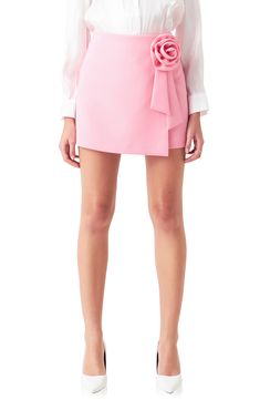 Make a sweet statement in this faux-wrap miniskirt decorated with a charming rosette detail. Lined 96% polyester, 4% spandex Hand wash, dry flat Imported Unique Selling Point, Mini Skirt Pink, Rush Outfits, Dainty Dress, Classy Skirts, Rose Corsage, Comfortable Skirts, Statement Skirt, College Fits